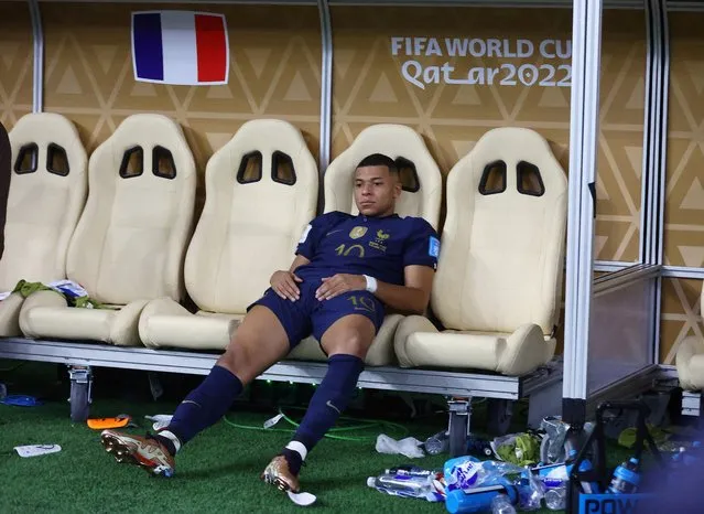 Kylian Mbappe of France looks dejected on the bench after a penalty shoot out loss during the FIFA World Cup Qatar 2022 Final match between Argentina and France at Lusail Stadium on December 18, 2022 in Lusail City, Qatar. (Photo by Carl Recine/Reuters)