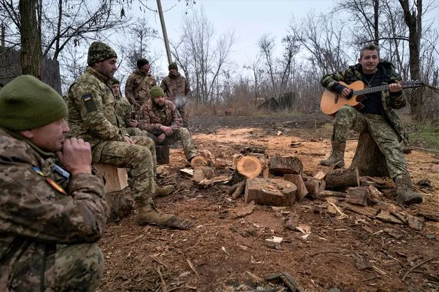 Acclaimed Ukrainian singer Kolia Cerga performs for Ukrainian soldiers of the 59th brigade near the frontline on December 25, 2022 in Donetsk, Ukraine. Ukrainians celebrate Catholic Christmas on December 25 as the Orthodox Christmas on January 7 is considered a Russian tradition. (Photo by Pierre Crom/Getty Images)