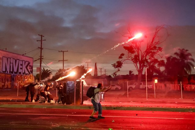 Protesters demonstrating against operations conducted by federal immigration authorities clash with law enforcement officials in Compton, Calif., Saturday, June 7, 2025. (Photo by Chelsea Lauren/Rex Features/Shutterstock)