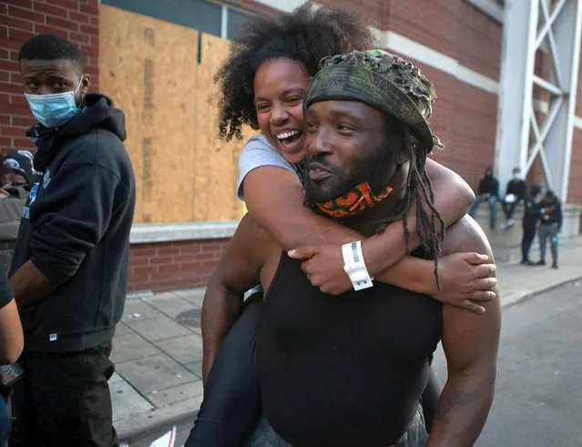 A woman celebrates after she was released from jail a day after a grand jury decided not to bring homicide charges against police officers involved in the fatal shooting of Breonna Taylor in her apartment, in Louisville, Kentucky, U.S. September 24, 2020. (Photo by Lawrence Bryant/Reuters)