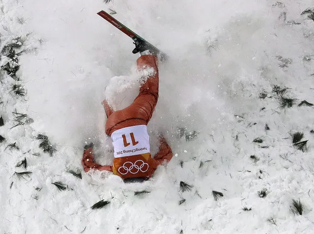Alla Tsuper, of Belarus, crashes during the women's freestyle aerial final at Phoenix Snow Park at the 2018 Winter Olympics in Pyeongchang, South Korea, Friday, February 16, 2018. (Photo by Lee Jin-man/AP Photo)