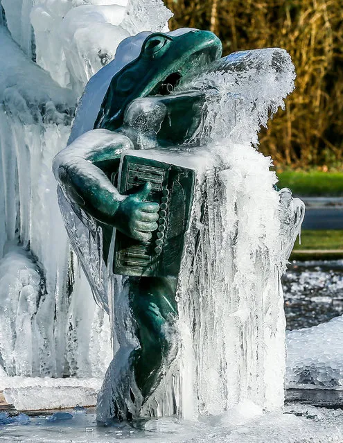 A view of the frozen fountain 'Bandundu Water Jazz Band' of the artist Tom Frantzen next to the Central African Museum in Tervuren near Brussels, Belgium, 27 February 2018.  Media reports state that extreme cold weather is forecast to hit many parts of Europe with temperatures plummeting to a possible ten year low. (Photo by Stephanie LeCocq/EPA/EFE)