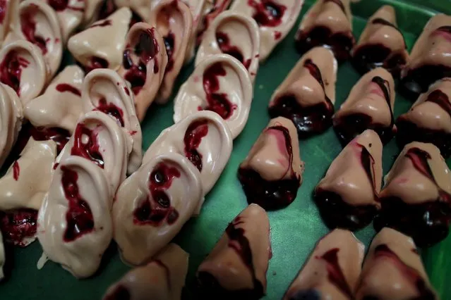 Bloody ears and noses made of gummy candy and red jelly are pictured at the Zombie Gourmet homemade candy manufacturer  on the outskirts of Mexico City October 30, 2015. (Photo by Carlos Jasso/Reuters)