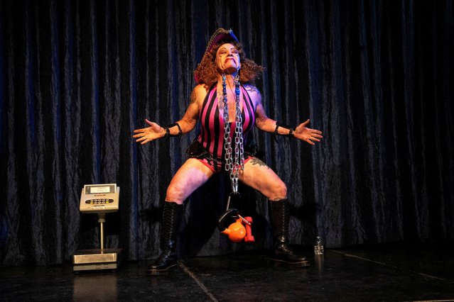 Faux Pas le Fae, a sideshow performer also known as the Pirate Queen of Coney Island, attempts to break the Guinness World Record for heaviest weight lifted with hooks through the cheeks, at Coney Island Circus Sideshow in Brooklyn, New York, on August 31, 2025. (Photo by Christian Monterrosa/Reuters)