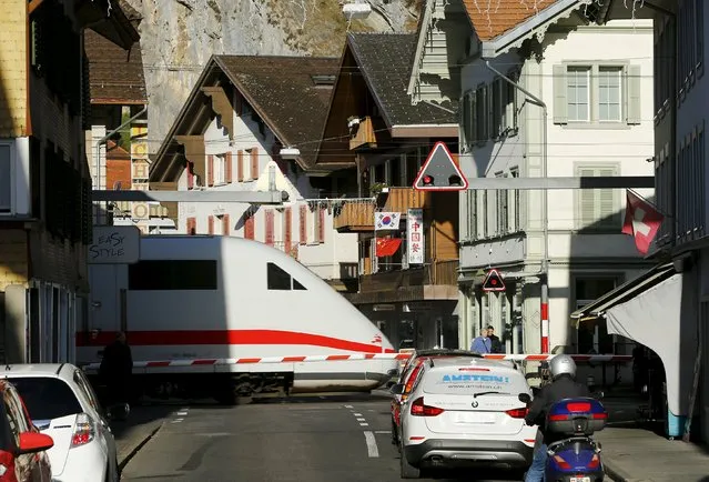 A German Inter City Express ICE train passes a street in the Swiss mountain resort Interlaken, Switzerland, November 17, 2015. (Photo by Ruben Sprich/Reuters)