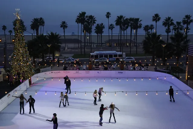 Guests of the Pasea Hotel ice skate across the street from the beach Wednesday, December 23, 2020, in Huntington Beach, Calif. (Photo by Ashley Landis/AP Photo)