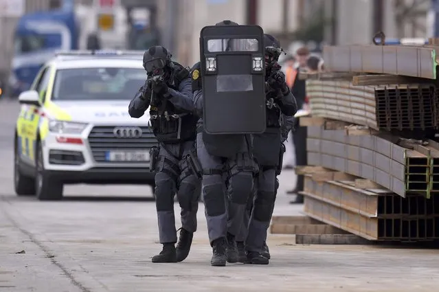 Irish Police (An Garda Siochana) and Emergency Support Unit (ERU) officers demonstrate an operational response to a scenario of an attack and hostage situation on a Port during an emergency training session in Drogheda, Ireland October 27, 2016. (Photo by Clodagh Kilcoyne/Reuters)