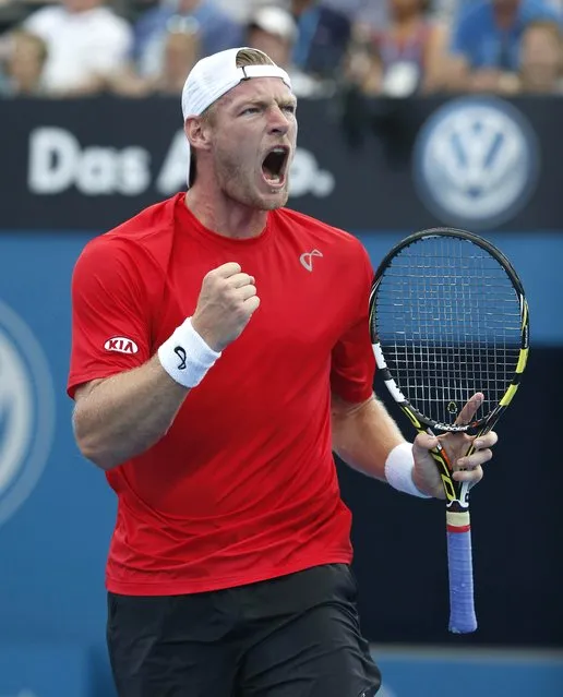 Sam Groth of Australia celebrates winning the second set of his men's singles quarter final against Milos Raonic of Canada at the Brisbane International tennis tournament in Brisbane, January 9, 2015. (Photo by Jason Reed/Reuters)