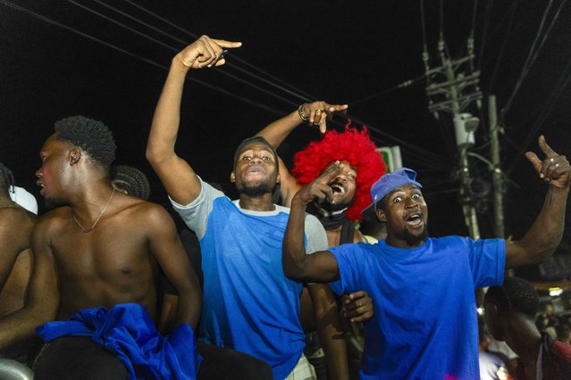 Soccer enthusiasts celebrate Haiti's qualification for the 2026 World Cup soccer tournament, in Port Au Prince, Haiti, 18 November 2025. Haiti was first in their CONCACAF group after beating Nicaragua 2-0, which automatically leads them to the World Cup qualification for the first time in 52 years. (Photo by Mentor David Lorens/EPA)