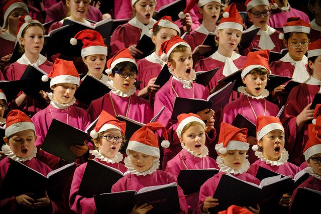 The Christmas Concert at Norwich Cathedral, UK on December 12, 2025 where during the second half of the programme the choristers don Santa hats and cathedra's master of music, Ashley Grote casts off his cassock to reveal a festive suit before choir and congregation join together in traditional Christmas carols. (Photo by Jason Bye)
