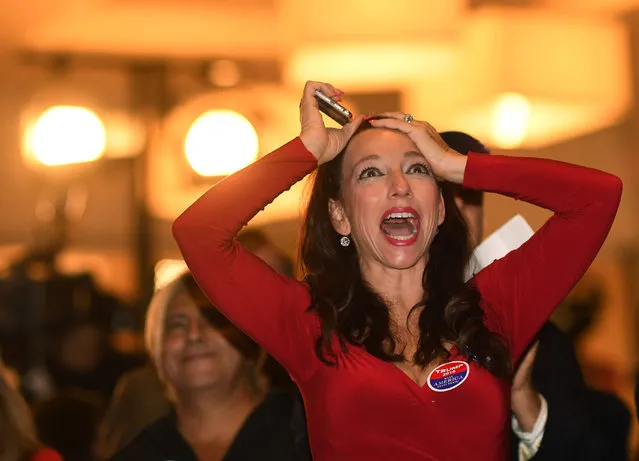 Mia Hofmann, Trump supporter, celebrates returns coming in during the Colorado Republican Election Night party at the DoubleTree Hilton in the Denver Tech Center, November 08, 2016. People gather to watch returns come in throughout the night. (Photo by R.J. Sangosti/The Denver Post via Getty Images)