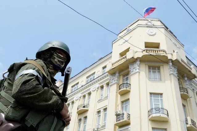 A member of Wagner group stands guard in a street in the city of Rostov-on-Don, on June 24, 2023. President Vladimir Putin on June 24, 2023 said an armed mutiny by Wagner mercenaries was a “stab in the back” and that the group's chief Yevgeny Prigozhin had betrayed Russia, as he vowed to punish the dissidents. Prigozhin said his fighters control key military sites in the southern city of Rostov-on-Don. (Photo by AFP Photo/Stringer)