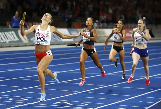 Poland's Justyna Swiety-Ersetic celebrates when crossing the line of the women's 4x400-meter final at the European Athletics Championships at the Olympic stadium in Berlin, Germany, Saturday, August 11, 2018. (Photo by Matthias Schrader/AP Photo)