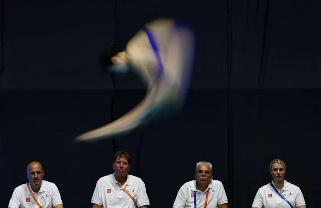 Judges look on as China's Yani Chang competes during the women's 3m springboard semifinal at the 2023 World Aquatics Championships in Fukuoka, Japan on July 20, 2023. (Photo by Marko Djurica/Reuters)