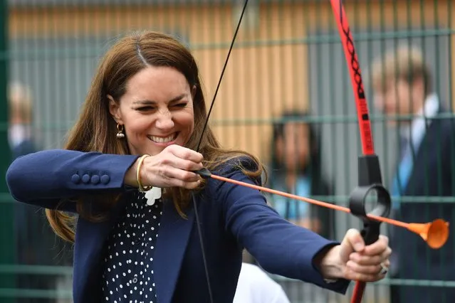 Britain's Catherine, Duchess of Cambridge takes part in an archery lesson as she visits The Way Youth Zone in Wolverhampton, central England on May 13, 2021. (Photo by Jacob King/Pool via AFP Photo)