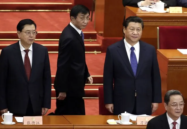 China's President Xi Jinping (R), Yu Zhengsheng (front), chairman of the National Committee of the Chinese People's Political Consultative Conference (CPPCC), and Zhang Dejiang (L), chairman of the Standing Committee of the National People's Congress (NPC), stand during the opening session of CPPCC at the Great Hall of the People in Beijing, March 3, 2015. REUTERS/Jason Lee