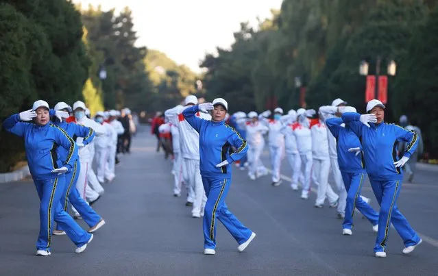 This photo taken on October 17, 2023 shows people dancing at a park in Shenyang, in China's northeastern Liaoning province. (Photo by AFP Photo/China Stringer Network)