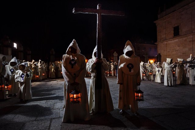 Penitents of the Santisimo Cristo del Espiritu Santo brotherhood take part in a Holy Week procession in Zamora, Spain, Friday, March 27, 2015. Hundreds of processions take place throughout Spain during the Easter Holy Week. (AP Photo/Daniel Ochoa de Olza)