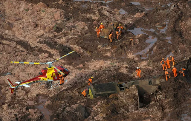 Rescue crew work in a tailings dam owned by Brazilian miner Vale SA that burst, in Brumadinho, Brazil on January 25, 2019. (Photo by Washington Alves/Reuters)