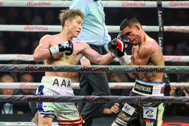 Naoya Inoue (L) of Japan connects his left on Marlon Tapales (R) of the Philippines in the 5th round during the IBF, WBO, WBA and WBC Super Bantamweight unification title bout at Ariake Arena on December 26, 2023 in Tokyo, Japan. (Photo by The Asahi Shimbun via Getty Images)