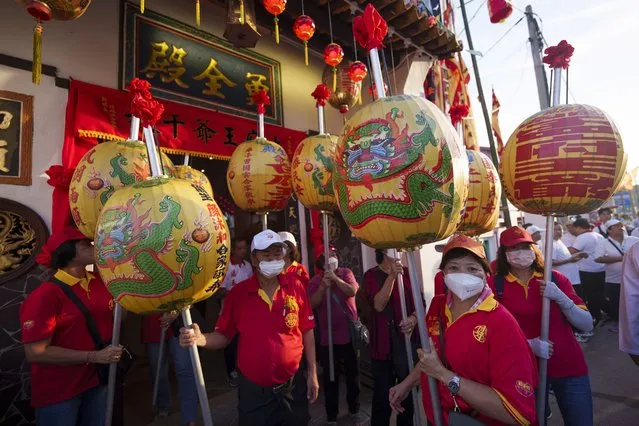 Ethnic Chinese devotees prepare for a procession during Wangkang or “royal ship” festival at Yong Chuan Tian Temple in Malacca, Malaysia, Thursday, January 11, 2024. (Photo by Vincent Thian/AP Photo)