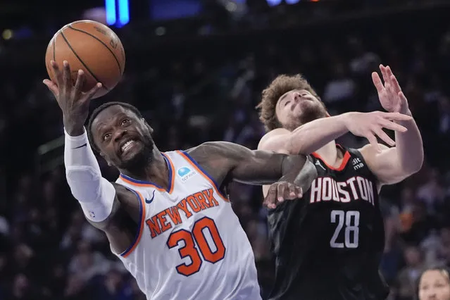 New York Knicks forward Julius Randle (30) and Houston Rockets center Alperen Sengun (28) fight for a rebound in the second half of an NBA basketball game, Wednesday, January 17, 2024, at Madison Square Garden in New York. (Photo by Mary Altaffer/AP Photo)