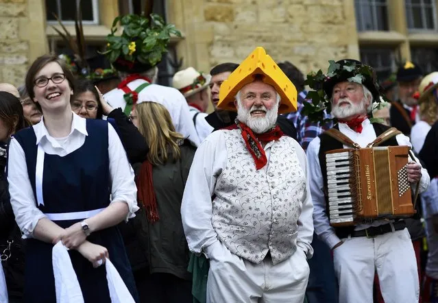 Morris Dancers celebrate beside The Bridge of Sighs in the early hours during traditional May Day celebrations in Oxford, Britain, May 1, 2015. (Photo by Dylan Martinez/Reuters)