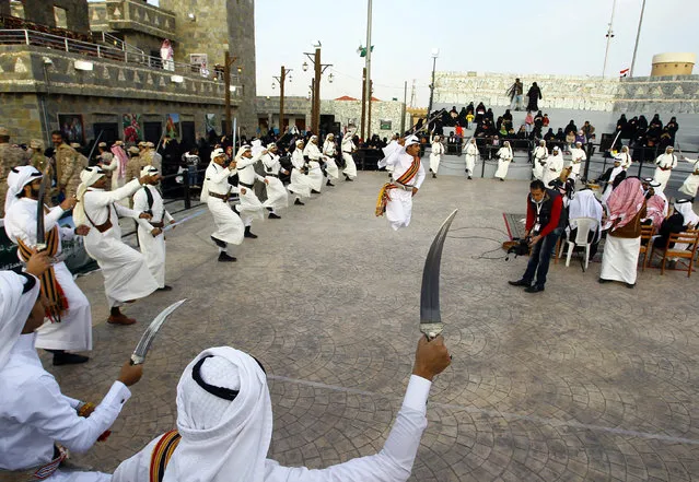 Saudi men perform a traditional dance during Janadriyah Cultural Festival on the outskirts of Riyadh, Saudi Arabia February 8, 2017. (Photo by Faisal Al Nasser/Reuters)
