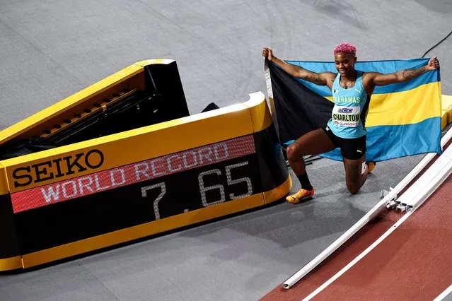 First-placed Bahamas' Devynne Charlton poses next to the score board reading her world record after winning the Women's 60m hurdles final during the Indoor World Athletics Championships in Glasgow, Scotland, on March 3, 2024. (Photo by Anne-Christine Poujoulat/AFP Photo)