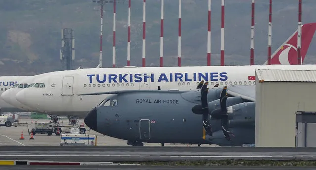 A British air force plane is pictured at Istanbul Airport in Istanbul, Tuesday, April 21, 2020. According to reports the plane arrived to transport medical equipment back to Britain. British officials have been scrambling to source much needed personal protective equipment (PPE) for medical staff and said a consignment of 84 tons, including 400,000 gowns, would arrive from Turkey. (Photo by Ibrahim Mase/DHA via AP Photo)
