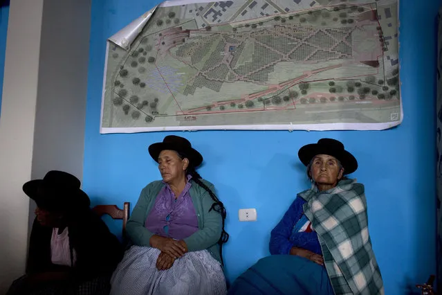 In this March 30, 2016 photo, women whose relatives were killed or disappeared during Peru's two decades of political violence (1980-2000) sit inside the Memory Museum in Ayacucho, Peru. While about half of Peruvians say they would never vote for anyone connected to the former strongman Alberto Fujimori, rural voters haunted by the conflict that claimed 70,000 lives say the country needs a firm hand to keep violence at bay and plan to cast ballots for his daughter, Keiko Fujimori, in the April 10 election. (Photo by Rodrigo Abd/AP Photo)