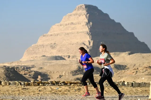 Participants run in front of the Step Pyramid of Djoser during the Saqqara Race on February 9, 2024 in Giza, Egypt. (Photo by Sayed Hassan/Getty Images)