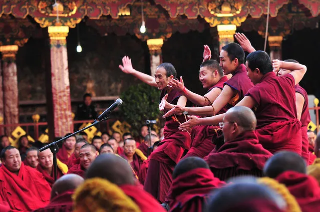 Tibetan lamas take part in a ceremony to award “Geshe Lharampa” degree, an academic degree for Tibetan Buddhism at Jokhang Temple, Lhasa, Tibet Autonomous Region, China, April 10, 2016. (Photo by Reuters/China Daily)