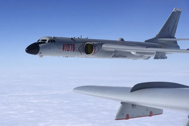 In this November 23, 2017, photo released by Xinhua News Agency, a Chinese military H-6K bomber is seen conducting training exercises, as the People's Liberation Army (PLA) air force conducted a combat air patrol in the South China Sea. With record numbers of military flights near Taiwan over the last week, China has been stepping up its harassment of the island it claims as its own, showing an new intensity and sophistication as it asserts its territorial claims in the region. (Photo by Wang Guosong/Xinhua via AP Photo)