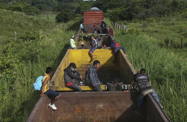 Honduran migrants ride a freight train on their way north, in Salto del Agua, Chiapas state, Mexico, Tuesday, June 25, 2019. The group’s next stop will be Coatzacoalcos, Veracruz state. Mexico has deployed 6,500 National Guard members in the southern part of the country, plus another 15,000 soldiers along its northern border in a bid to reduce the number of migrants traveling through its territory to reach the U.S. (Photo by Marco Ugarte/AP Photo)