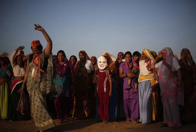 Supporters of Hindu nationalist Narendra Modi, prime ministerial candidate for the main opposition Bharatiya Janata Party (BJP), chant slogans as they leave after attending a rally in Gurgaon on the outskirts of New Delhi April 3, 2014. India, the world's largest democracy, will hold its general election in nine stages staggered between April 7 and May 12. (Photo by Adnan Abidi/Reuters)