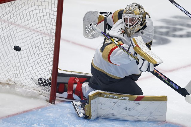 Vegas Golden Knights goaltender Adin Hill eyes the puck on a scoring shot by Dallas Stars center Radek Faksa during the third period in Game 7 of an NHL hockey Stanley Cup first-round playoff series, Sunday, May 5, 2024, in Dallas. (Photo by Brandon Wade/AP Photo)
