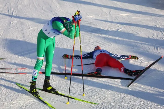 Ireland's Thomas Maloney Westgaard (L) reacts after crossing the finish line of the men's skiathlon 2x15km event during the Beijing 2022 Winter Olympic Games on February 6, 2022, at the Zhangjiakou National Cross-Country Skiing Centre. (Photo by Marko Djurica/Reuters)