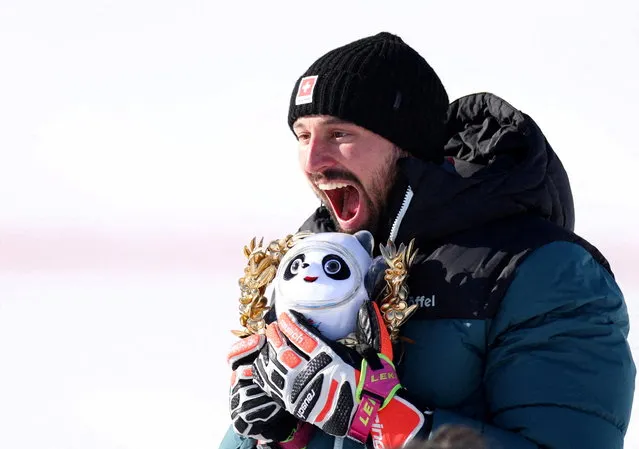Ryan Regez of Switzerland celebrates after winning the gold medal during the victory ceremony of the Men's Ski Cross Final at Genting Snow Park in Zhangjiakou, Hebei, China on Feb. 18, 2022. (Photo by Lisi Niesner/Reuters)
