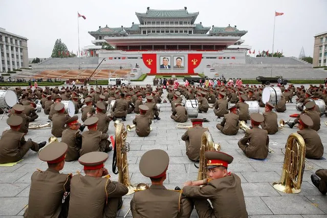 Members of a military band rest by their instruments at the capital's main ceremonial square after a mass rally and parade, a day after the ruling party wrapped up its first congress in 36 years by elevating him to party chairman, in Pyongyang, North Korea, May 10, 2016. (Photo by Damir Sagolj/Reuters)