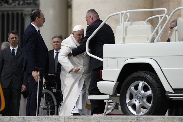 Pope Francis helped to get on his car at the end of weekly general audience in St. Peter's Square, at the Vatican, Wednesday, March 29, 2023. Pope Francis went to a Rome hospital on Wednesday for some previously scheduled tests, slipping out of the Vatican after his general audience and before the busy start of Holy Week this Sunday. (Photo by Alessandra Tarantino/AP Photo)
