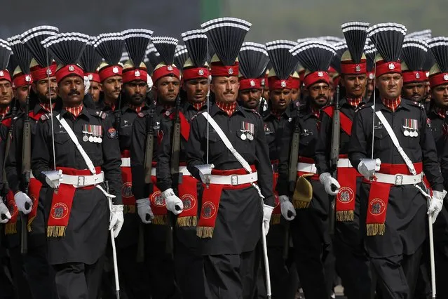 Pakistani paramilitary troops march during a military parade to mark Pakistan National Day in Islamabad, Pakistan, Wednesday, March 23, 2022. Pakistanis celebrated their National Day on Wednesday with a military parade in the capital, Islamabad, showcasing this Islamic nation's elite army units and high-tech weaponry, including short, medium, and long-range missiles, tanks, fighter jets and other hardware. (Photo by Anjum Naveed/AP Photo)