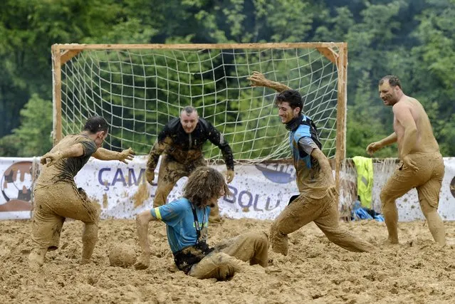 Participants in action during the Swamp Soccer event in Istanbul, Turkey 10 May 2014. The event will be held on 10-11 May and the winner team will attend Swamp Soccer Worl Cup in Scotland on 28-29 June 2014. (Photo by Erdem Sahin/EPA)