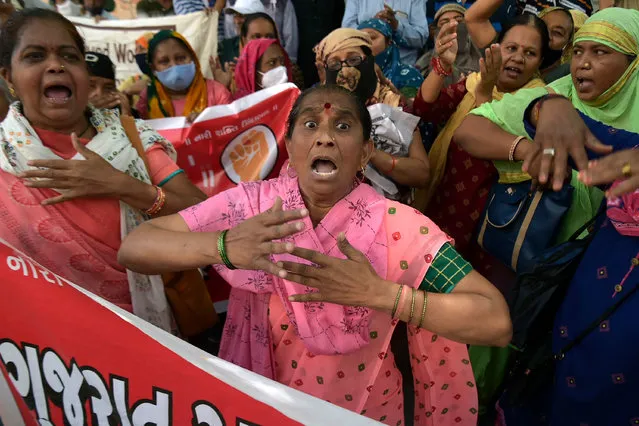 Protesters take part in a demonstration during a nationwide general strike against the policies of the central government, in Ahmedabad on March 28, 2022. (Photo by Sam Panthaky/AFP Photo)