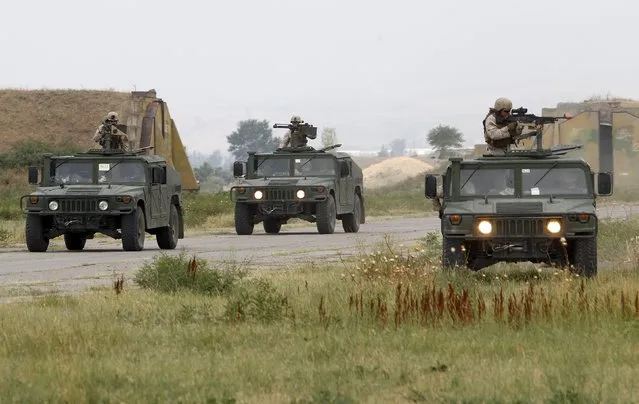 US marines drive their Humvees vehicles during a joint military exercise with NATO members, called “Agile Spirit 2015” at the Vaziani military base outside Tbilisi, Georgia, July 21, 2015. (Photo by David Mdzinarishvili/Reuters)