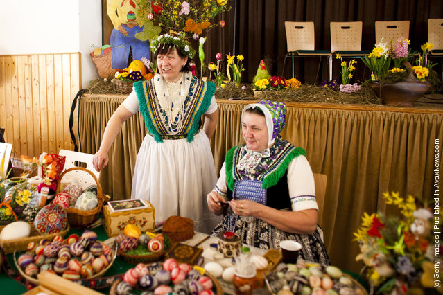 Women, wearing a traditional Lusatian sorbian folk dress, talk at the annual Sorbian Easter egg market