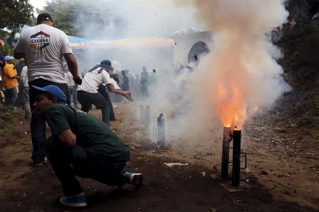 A man fires a homemade mortar during celebrations honouring the patron saint of Managua Santo Domingo de Guzman in Managua, Nicaragua, August 1, 2015. (Photo by Oswaldo Rivas/Reuters)
