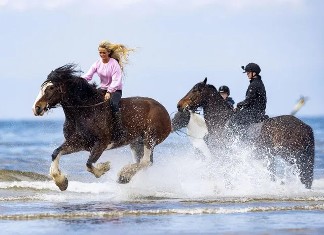 Many people headed to the coast at the weekend, with horseriders making the most of the sunshine at Irvine Beach, Ayrshire in south-west Scotland on May 7, 2022. (Photo by Roddy Scott/The Times)
