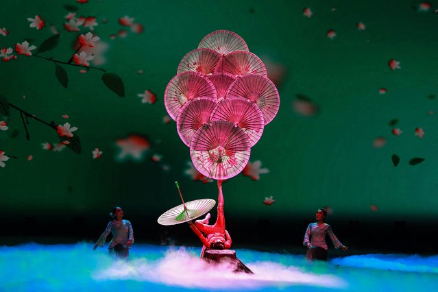 The photo taken on September 5, 2024 shows acrobats performing during a show at a theatre in Shenyang, in northeastern China's Liaoning province. (Photo by AFP Photo/China Stringer Network)