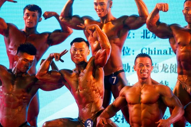 Participants pose as they take part in a bodybuilding and fitness event named “China Fit”, in Beijing, China, June 15, 2016. (Photo by Reuters/Stringer)